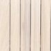 Light wood decking boards arranged vertically, showing grain patterns and small screws along the edges.
