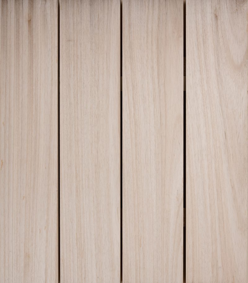 Close-up of vertical light wood planks with subtle grain and small gaps.