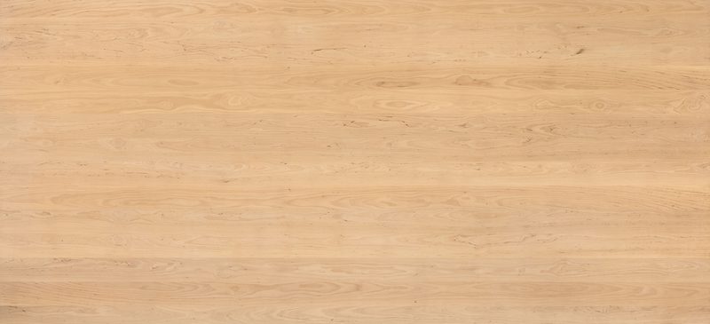 Light tan wood plank background with subtle grain patterns and small knots.