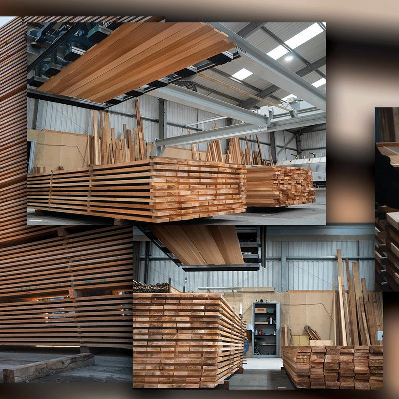 Stacks of lumber and planks in a warehouse, with an overhead crane and exposed metal beams.