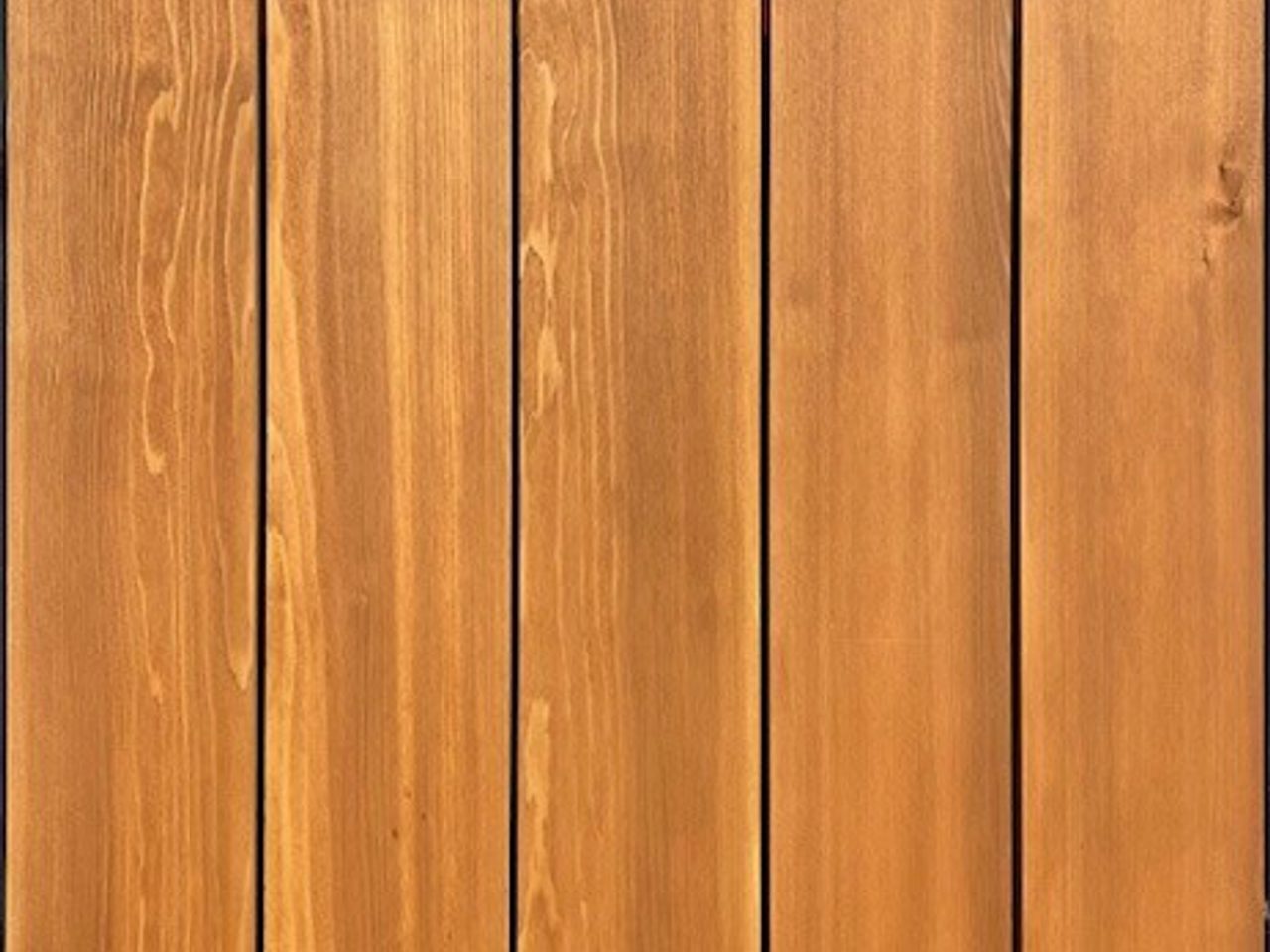 Vertical wooden planks with a warm brown finish, showing wood grain and small metal screws along the edges.