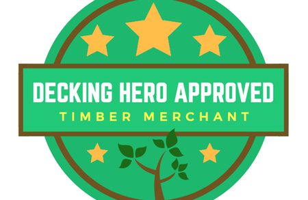 Green circular badge with brown border and a banner reading Decking Hero Approved and Timber Merchant; three yellow stars top and a tree at bottom.