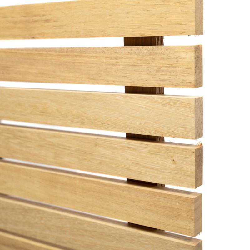 Close-up of light wooden slats arranged horizontally with small gaps, forming a wooden blind against a white background.