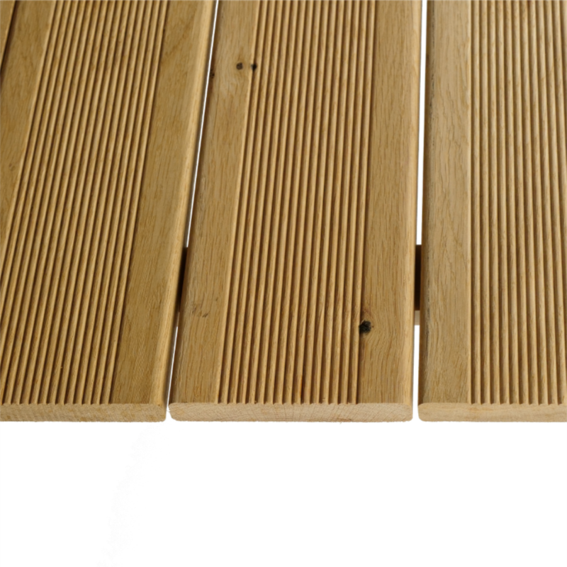 Close-up of three light brown grooved wooden boards with visible grain and knots, showing narrow gaps between planks against a white background.