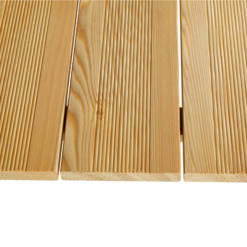 Close-up of three light wood boards showing prominent grain and narrow gaps between them against a white background.