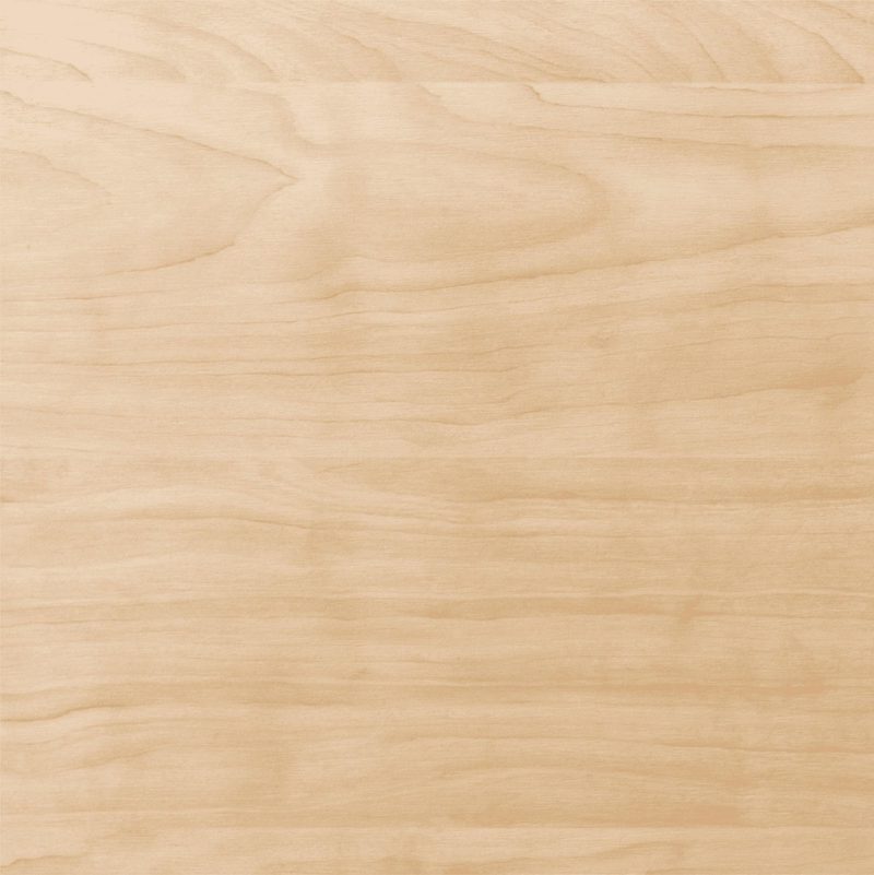 Light wood surface with natural grain patterns and warm beige tones.