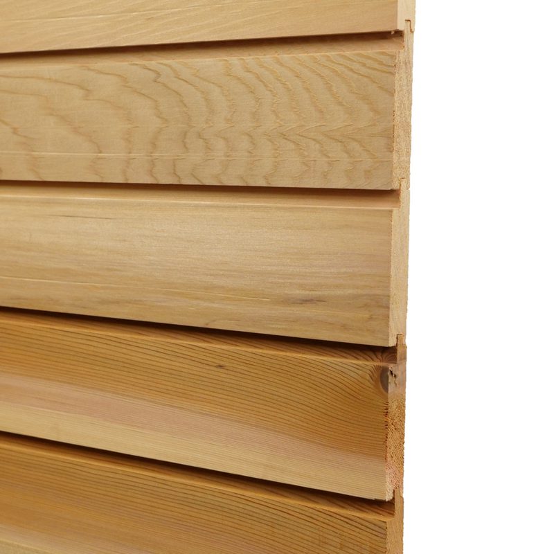 Close-up of light wooden planks stacked with visible grain, showing the exposed right edges.