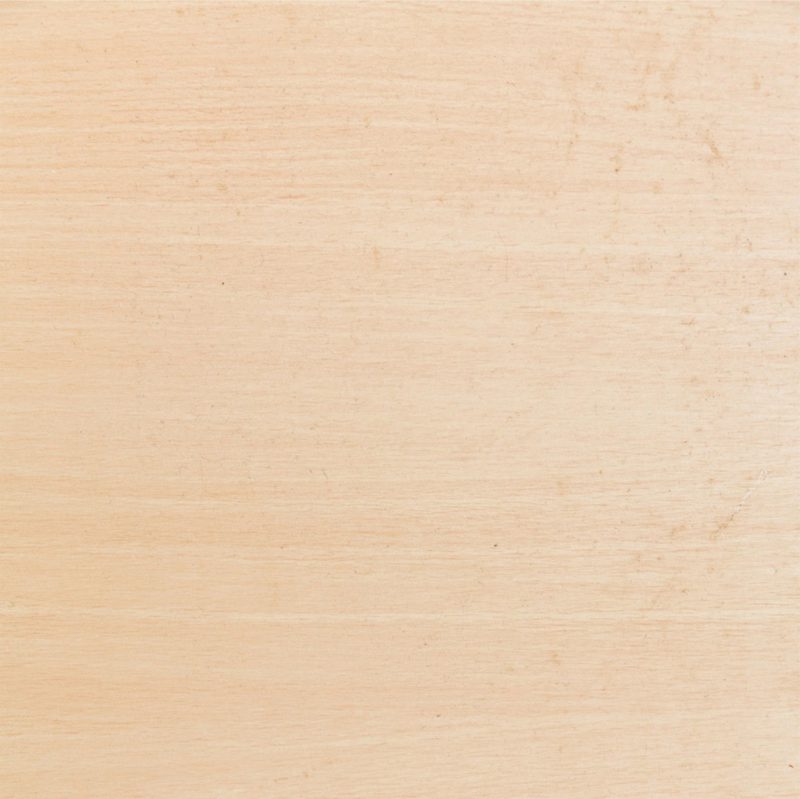 A pale wooden panel with soft beige tones and subtle horizontal grain lines.