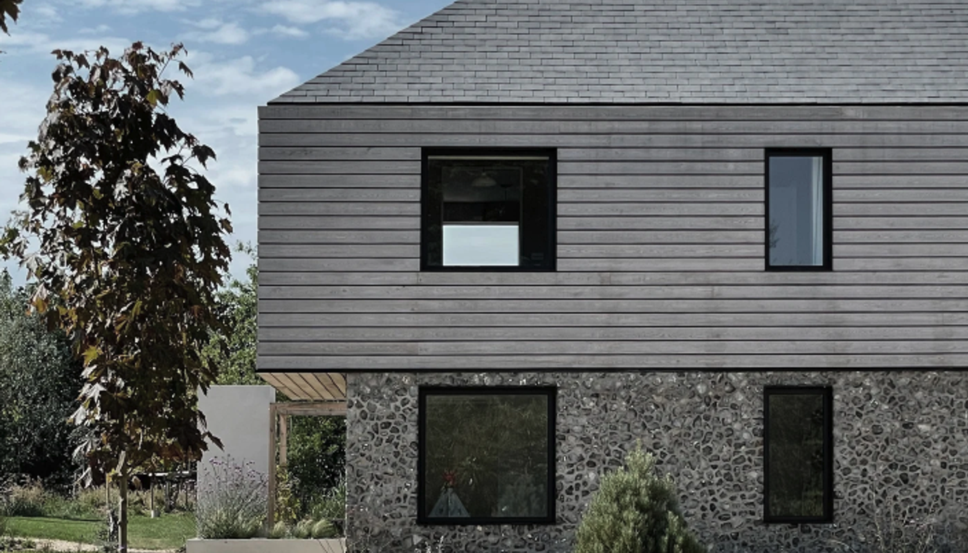 Grey horizontal cladding on a residential building.