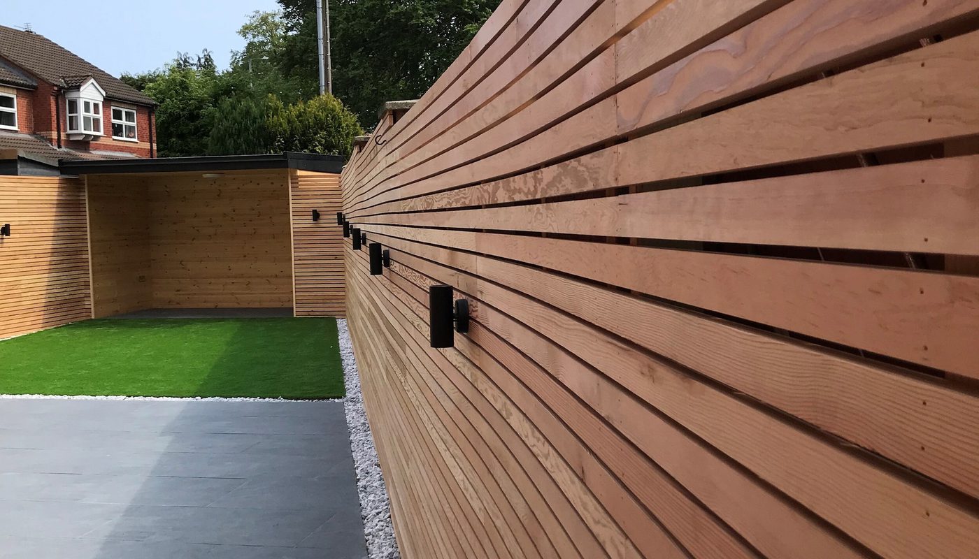 A stylish slatted fence showcasing douglas fir’s golden yellow colour.