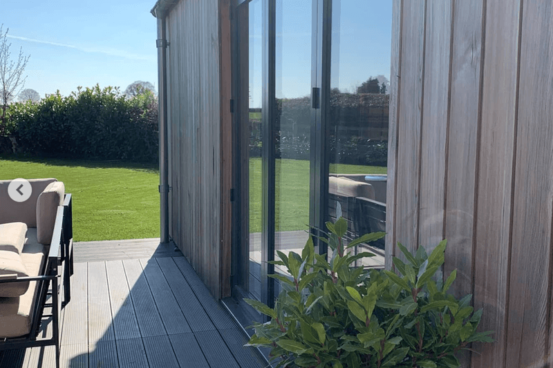Siberian Larch cladding on a stylish outbuilding, beginning to show signs of turning grey.