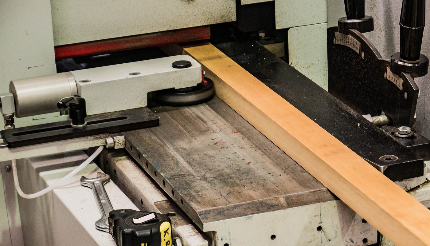 Inputting wood into the WEINIG PowerMat 1200 moulding machine.