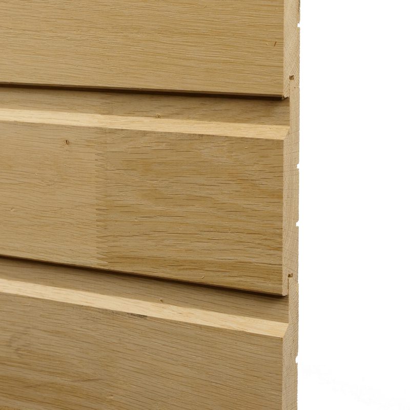 Close-up of light wood siding with horizontal planks and visible grain.