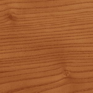 Close-up of a warm brown wood surface with visible grain patterns and small knots.