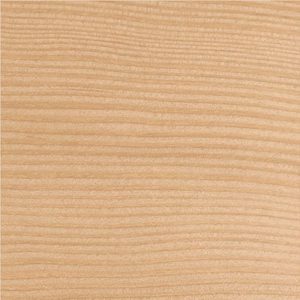 Close-up of a light wooden surface showing horizontal grain patterns and warm beige-brown tones.