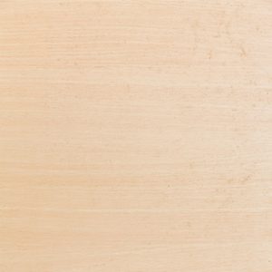 Light beige wooden surface with subtle grain patterns and faint scratches, resembling a smooth wooden plank.
