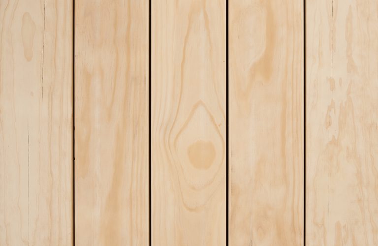 Vertical light wood planks with visible grain and narrow gaps between boards.