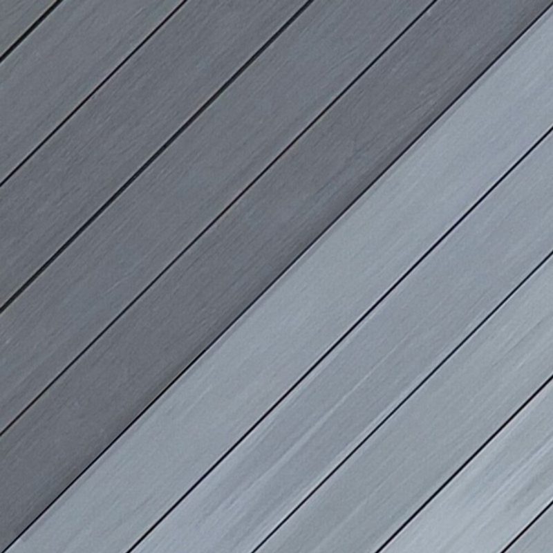 Diagonal grey wooden deck boards with visible grain and seams, showing alternating light and dark gray planks.