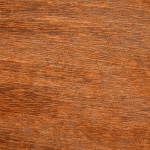 Close-up of a warm reddish-brown wood grain surface.