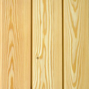 Close-up of vertical light pine wooden planks showing prominent grain patterns, a small knot, and narrow gaps between boards.