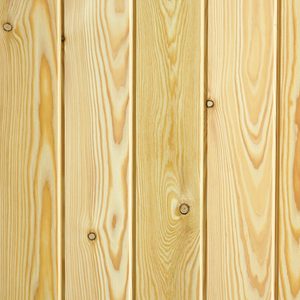 Close-up of vertical light-colored wooden planks with prominent grain patterns and knots.