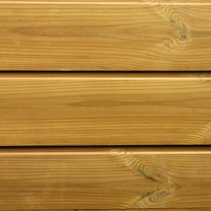 Close-up of horizontal wooden planks with warm honey-brown grain, visible knots, and narrow gaps between boards.