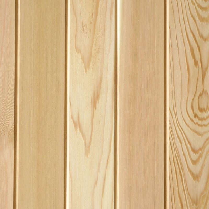 Close-up of vertical light wood planks with visible grain patterns and warm beige tones.