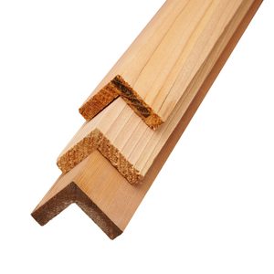 Three light pine wooden molding strips with L-shaped cross-sections, stacked diagonally to reveal grain and beveled edges.